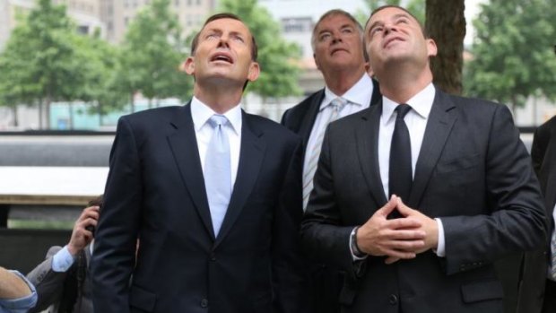 Prime Minister Tony Abbott looks up at the September 11 memorial in New York with memorial president Joe Daniels.