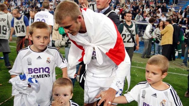 Four lads . . . David Beckham celebrates with his sons Brooklyn, Cruz and Romeo.
