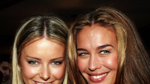 Cossie competition ... Jennifer Hawkins and Megan Gale pose together at Cleo Magazine's annual Swimsuit Party.