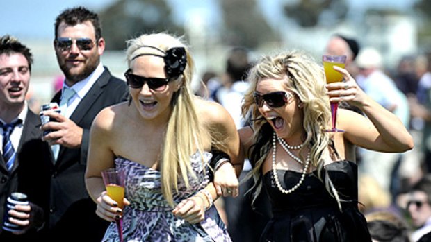 Come on, Clover! Amber Jeffreys and Nikita Bradley get into the spirit of things at yesterday's Geelong Cup. About 18,000 racegoers enjoyed the sunshine.