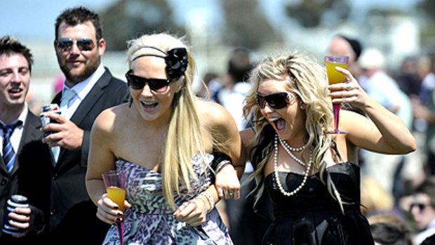 Come on, Clover! Amber Jeffreys and Nikita Bradley get into the spirit of things at yesterday's Geelong Cup. About 18,000 racegoers enjoyed the sunshine.