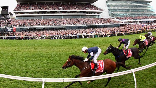 Brett Pebble riding Green Moon wins the Emirates Melbourne Cup during 2012 Melbourne Cup Day.