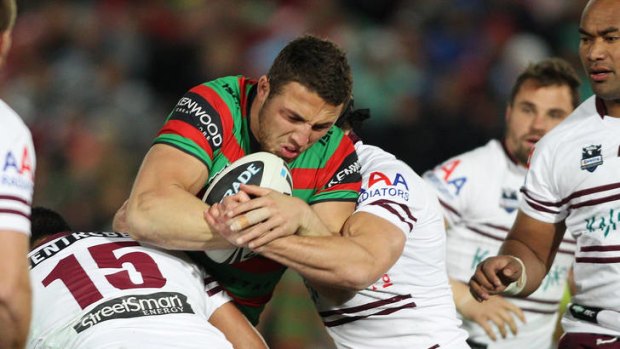 Hard to take ... Sam Burgess of the Rabbitohs is taken down by the Sea Eagles.