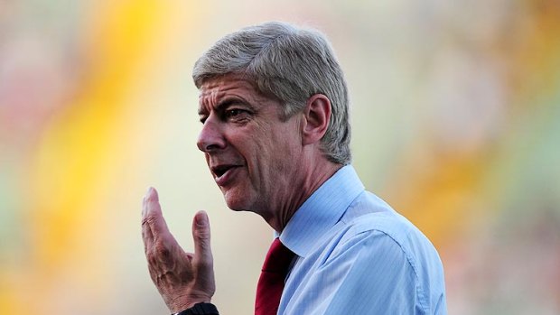 Pressure: Arsene Wenger during Arsenal’s nervy win over Udinese. Wenger is under increasing scrutiny after many years without a trophy.