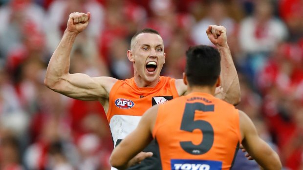 Maiden win: Tom Scully and Dylan Shiel celebrate during the 2016 AFL First Qualifying Final match between the Sydney Swans and the GWS Giants at ANZ Stadium.