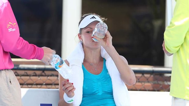Mixed fortunes ... Maria Kirilenko wilted in the heat in her singles match at the Sydney International on Tuesday before backing up for a win in the women’s doubles.