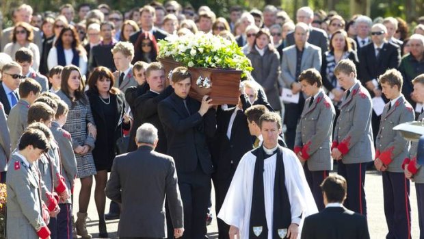 'He never did anything bad' ... Thomas Kelly's coffin is given a guard of honour as it is carried from the King's School and followed by his mother, Kathy, sister, Madeleine, and his father,  Ralph.