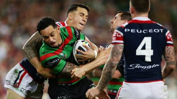 Leading the way: John Sutton goes into contact with Sonny Bill Williams on Friday night.