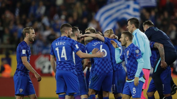 Easily done: Croatia's players celebrate at the end of their 0-0 second leg.