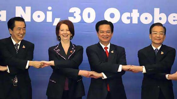 Prime Minister Julia Gillard joins hands with (from left) Japan’s Prime Minister Naoto Kan, Vietnam’s Prime Minister Nguyen Tan Dung and China’s Premier Wen Jiabao.