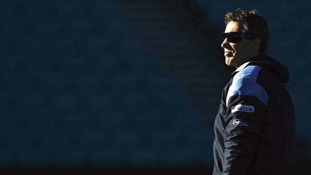 Under no illusions ... Craig Bellamy watches the Blues' training session at Parramatta Stadium yesterday. The coach doesn't expect to be retained for next year.