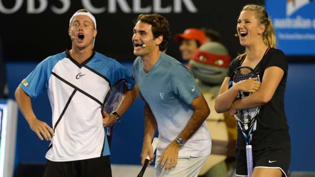 Lleyton Hewitt , Roger Federer and Victoria Azarenka share a laugh at Melbourne Park.