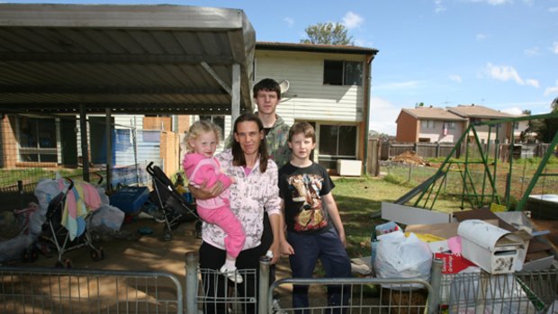 Last family to leave ... mother of six Michelle Asgill with  Rihanna, 3, Mark, 18, and Ricky, 12, at their home on Macbeth Way.