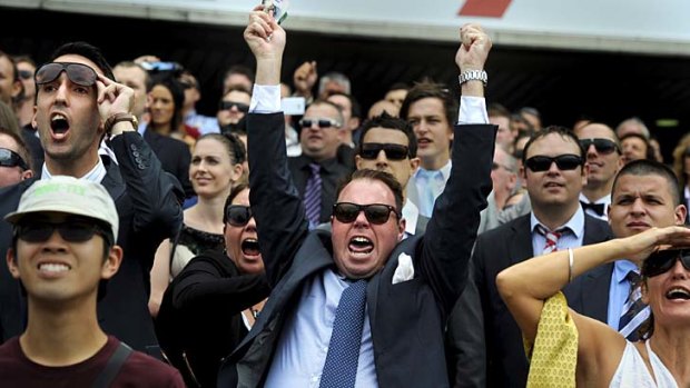 Up in arms: A punter celebrates on Golden Slipper Day;