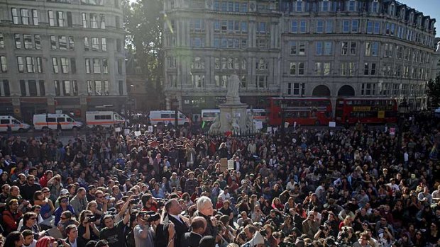 Big numbers ... Julian Assange addresses protesters attending the Occupy London Stock Exchange demonstration in London on Saturday.