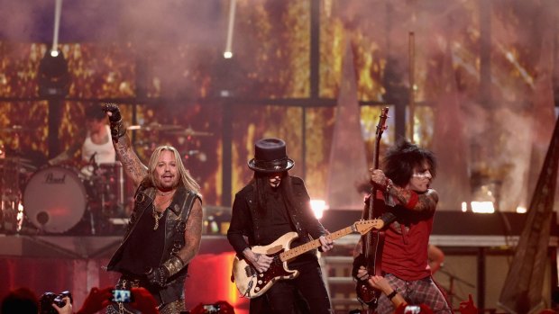 Drummer Tommy Lee, singer Vince Neil, guitarist Mick Mars and bassist Nikki Sixx of Motley Crue perform onstage during the 2014 iHeartRadio Music Festival at the MGM Grand Garden Arena on September 19, 2014 in Las Vegas, Nevada. 