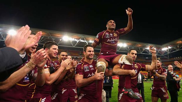 Petero Civoniceva's teammates carry him off the field after his final State of Origin match.