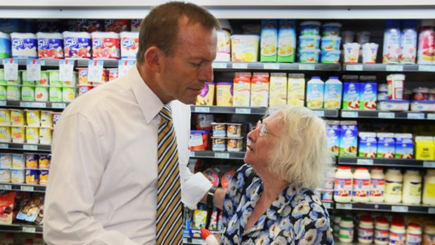 Inquiry in the dairy aisle … Tony Abbott talks with Marie, a shopper in Canberra, who wished to give only her first name.