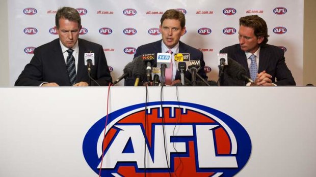 Last man standing: Ian Robson (left) and David Evans (centre) have departed, while James Hird (right) remains.