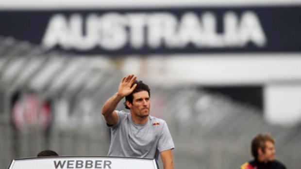 Mark Webber waves to the fans before today's race.