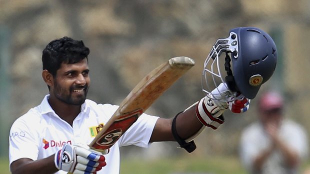 Sri Lanka's Kaushal Silva acknowledges the applause from the crowd after reaching three figures.