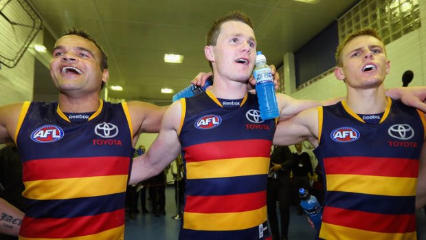 On song: The Crows celebrate their victory last night.