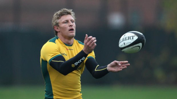 On the ball: Lachie Turner has been encouraged by Wallabies coach Robbie Deans to 'take that next step and really cement his place' at the top level.