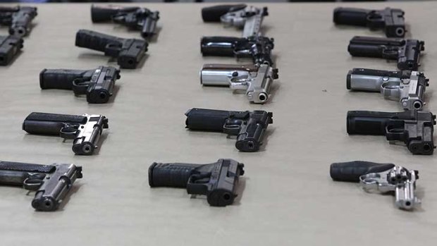 Police display handguns similar to the 22 that were  stolen.