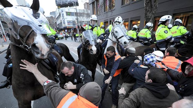 Protesters reportedly punched and hit police horses as they advanced on the picket line.