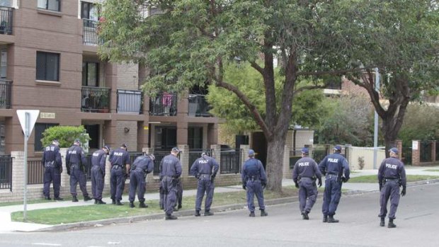 Police at the block of units  where police officer Bill  Crews died.