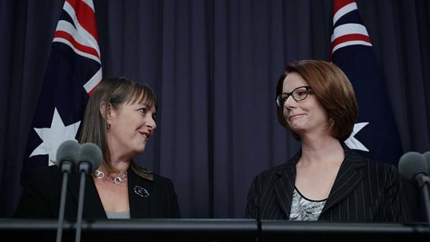Family time &#8230; Nicola Roxon watched over by Julia Gillard as she announces she is stepping down as Attorney-General.