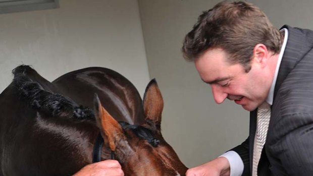 Well-deserved drink: Dunaden laps up his victory yesterday.