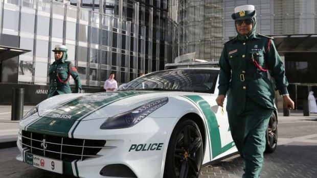 Hot wheels: The UAE's reputation as a wonderland of wealth and excess - epitomised by this Ferrari squad car belonging to Dubai Police - only partially conceals a repressive security apparatus.