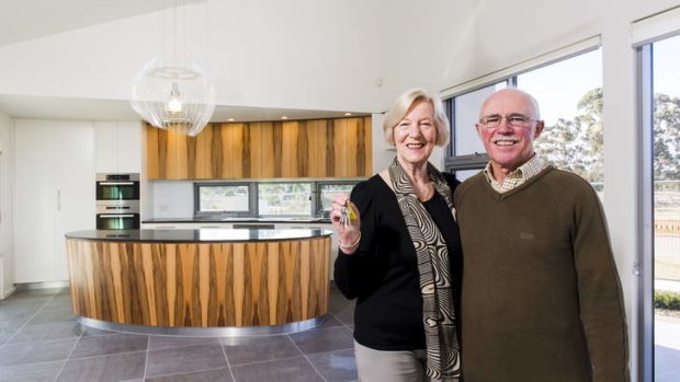 Anna and Phillip Burroughs, new owners of Canberra's first rotating house, in Crace.