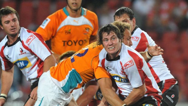 Cobus Grobbelaar of the Lions is tackled by Andries Strauss of the Cheetahs.