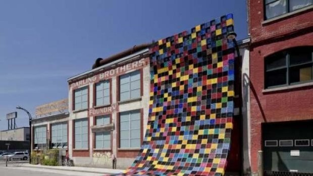 Courte-Pointe by Philippe Allard and Justin Duchesneau used milk crates to partially cover the entrance of Darling Foundry in Montreal