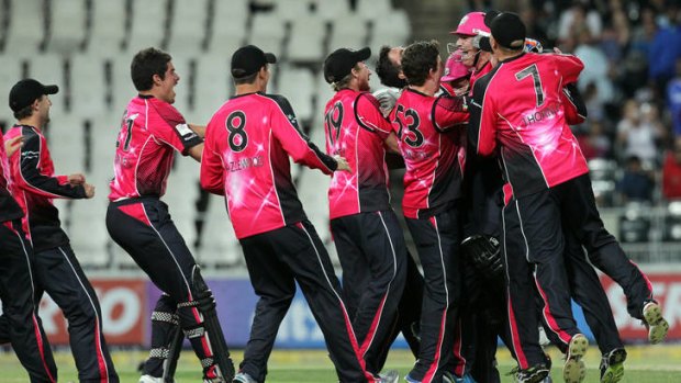 Victory ... Sydney Sixers's players celebrate after winning the final of the Champions League.
