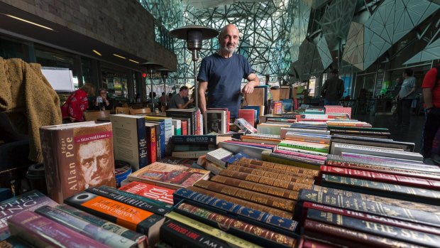 George Polykandrites with his books at Federation Square.