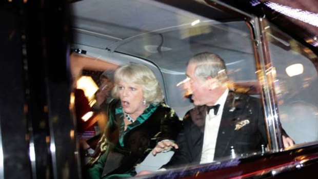 This is how it feels ... Prince Charles and the Duchess of Cornwall under attack from protesters.
