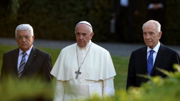 Pope Francis arrives with Palestinian leader Mahmoud Abbas and Israeli President Shimon Peres for a joint peace prayer in the gardens of the Vatican. 