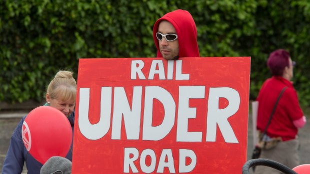 A protester at a rally against a sky rail on the Frankston train line. 