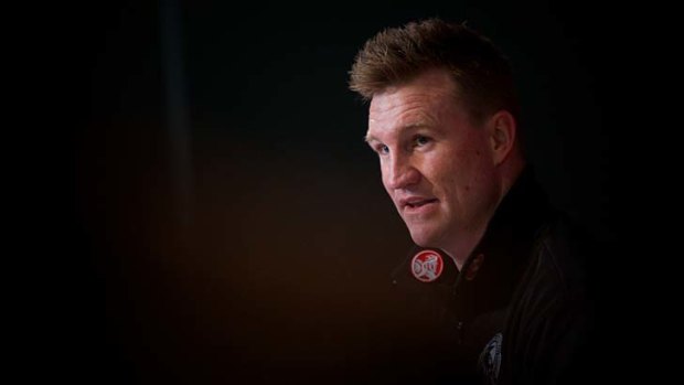 Collingwood coach Nathan Buckley talks to a packed media conference about star player Harry O'Brien.