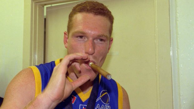 New Lions coach Justin Leppitsch celebrating the Lions' 2001 Grand Final win.
