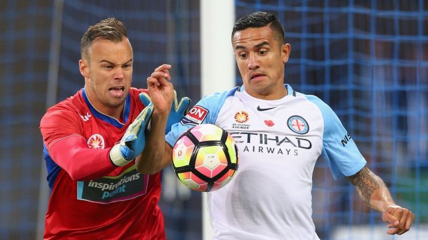 City's Tim Cahill in close combat with Jets goalkeeper Jack Duncan.