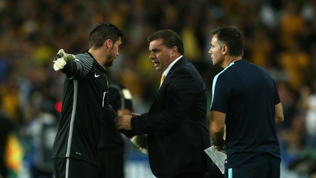 Follow my lead: Keeper Mathew Ryan gets instructions from Ange Postecoglou.