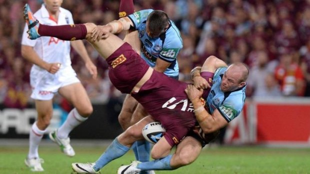 Mind on job: Josh Reynolds has been urged to ignore the outcry caused by this tackle in Origin I.