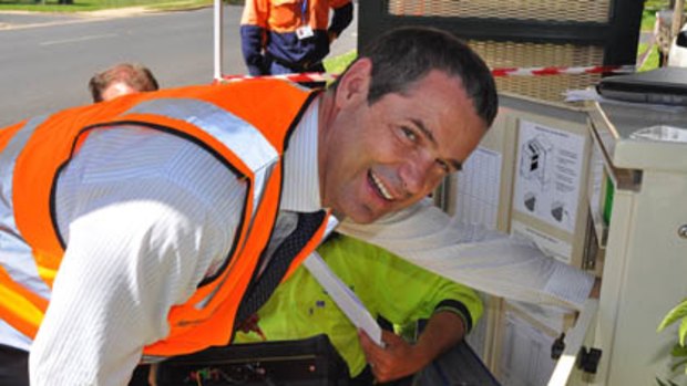 Conroy familiarises himself with the NBN at one of the installation sites in Niagara St Armidale, NSW.