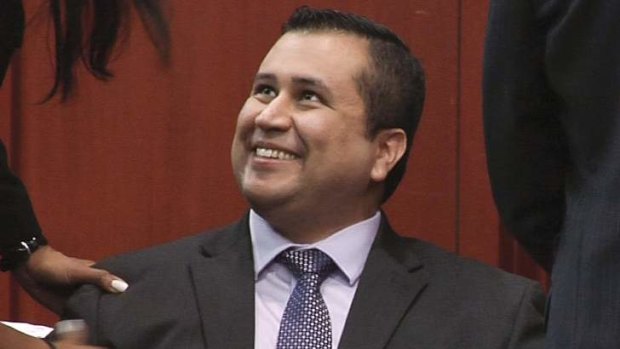 Relieved: George Zimmerman smiles after a not guilty verdict was handed down on Sunday.