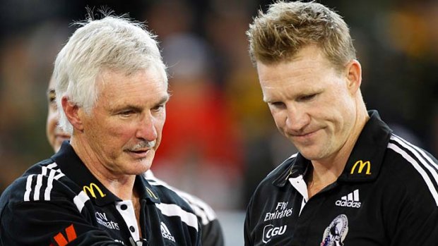 Magpies coach Mick Malthouse with assistant coach Nathan Buckley.