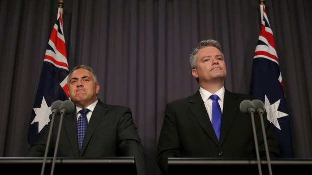 Keeping mum: Joe Hockey and Mathias Cormann have apparently ended their war on public service jobs ... but a surprise is buried in the budget's outlying years.